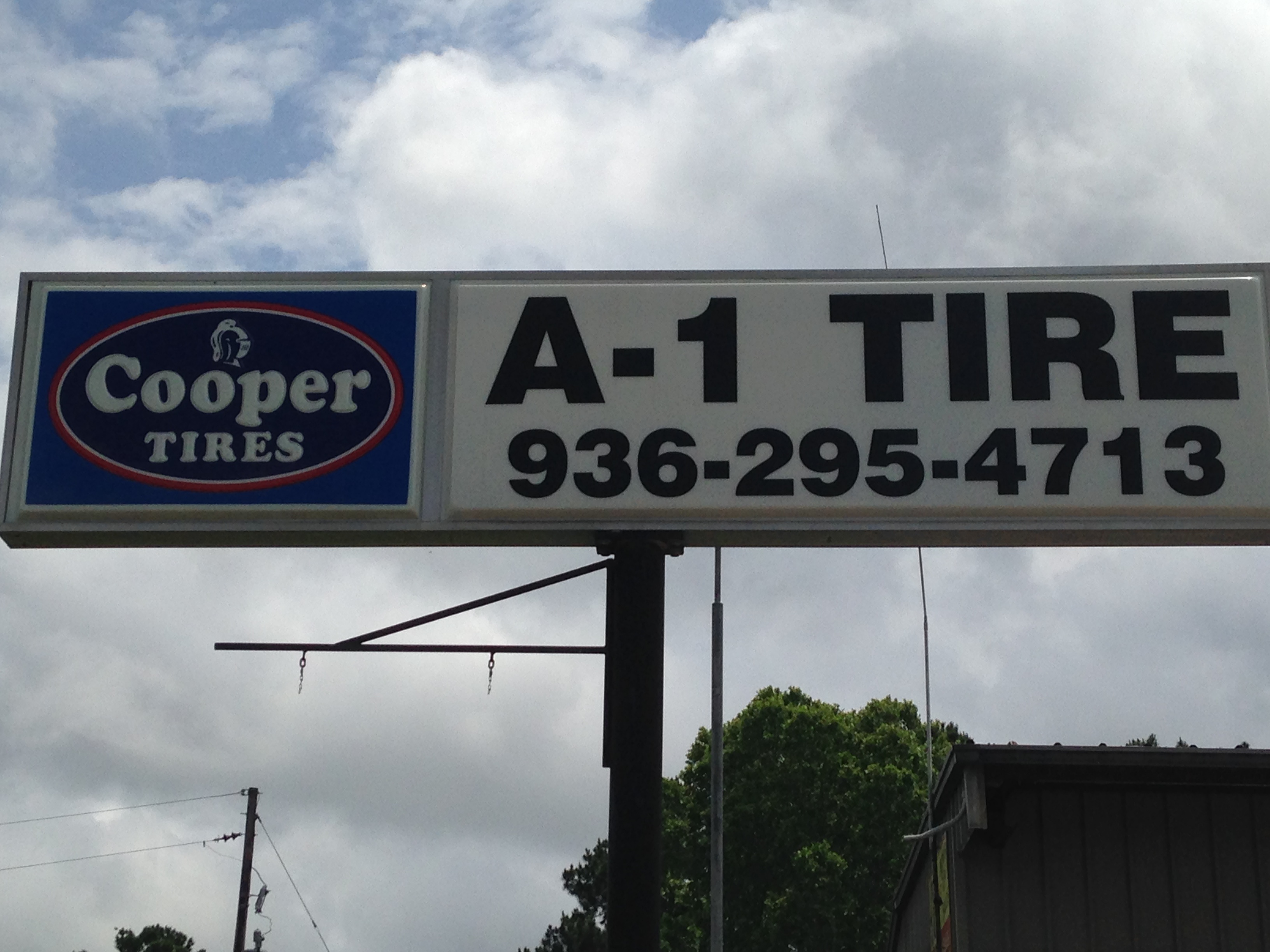 The A-1 Tire roadside sign advertising Cooper Tires outside our shop in Huntsville, Texas