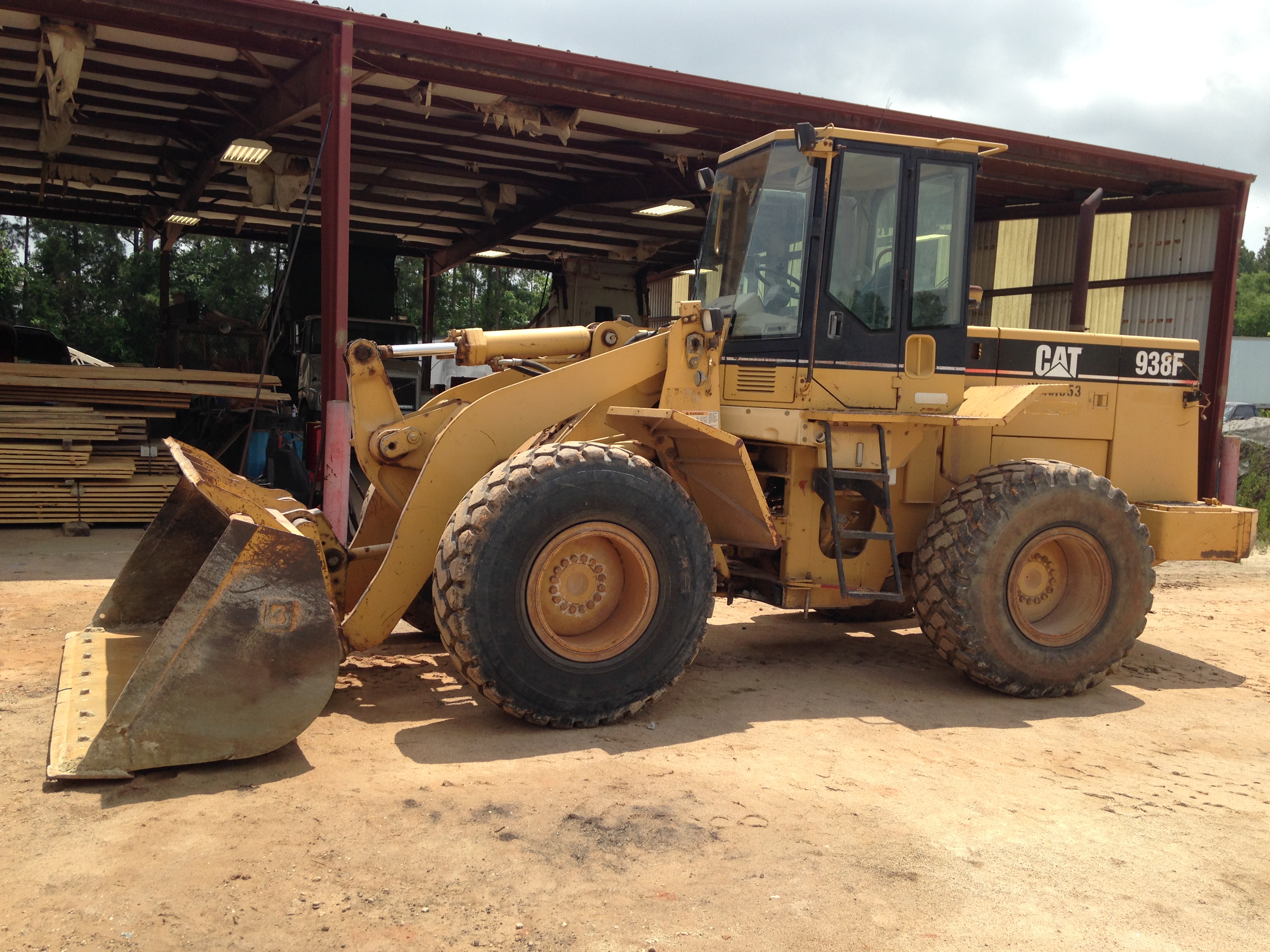 A CAT wheel loader parked under our equipment shed in Huntsville, Texas