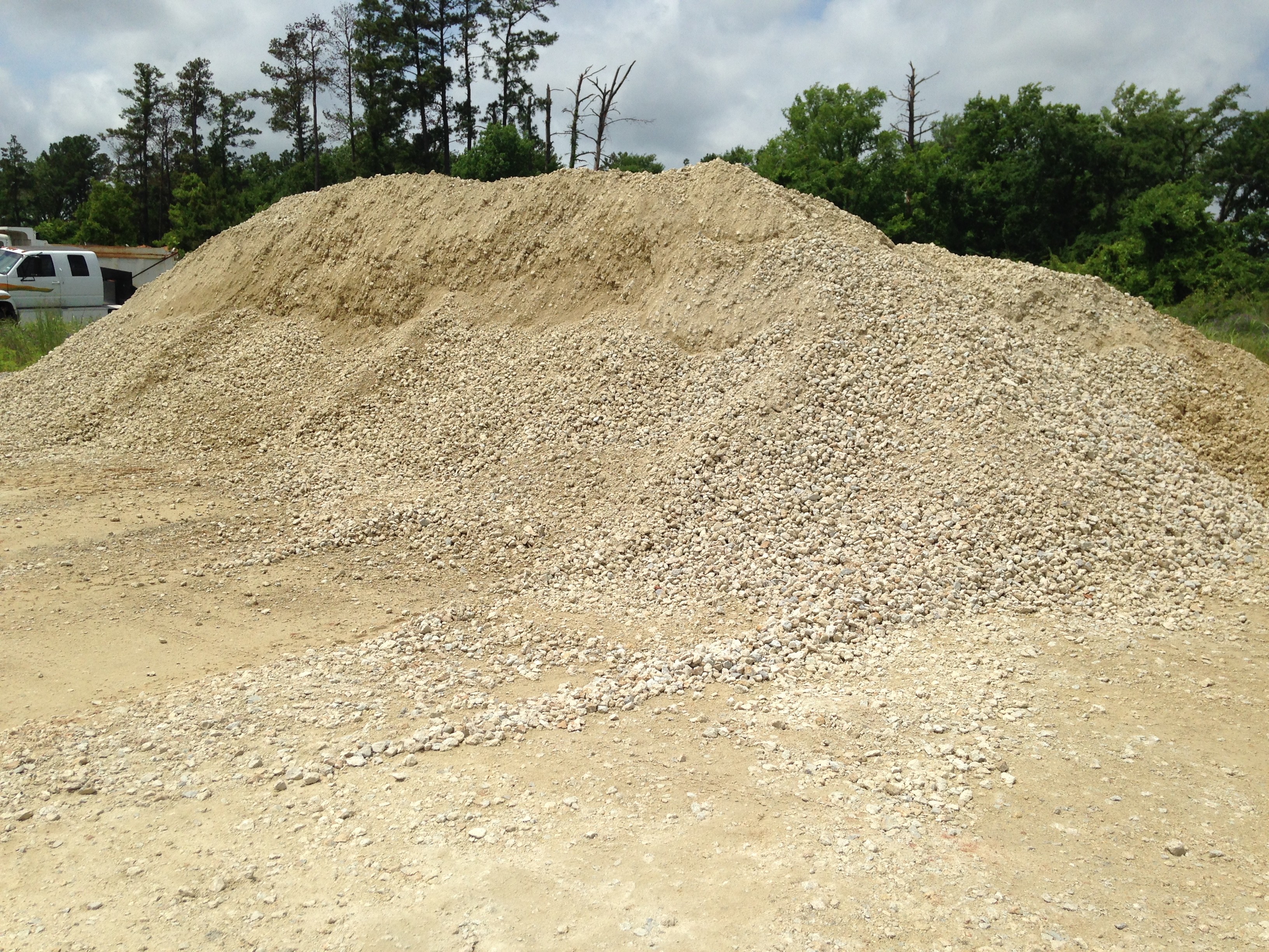 A mound of crushed limestone gravel stockpiled at our Huntsville, Texas yard